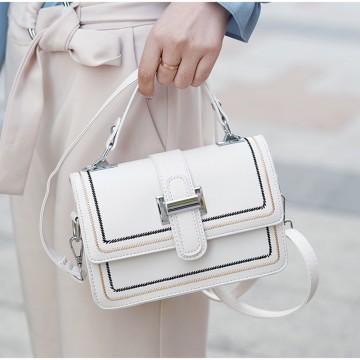 Жіноча сумка крос боді Corinne молочна фото